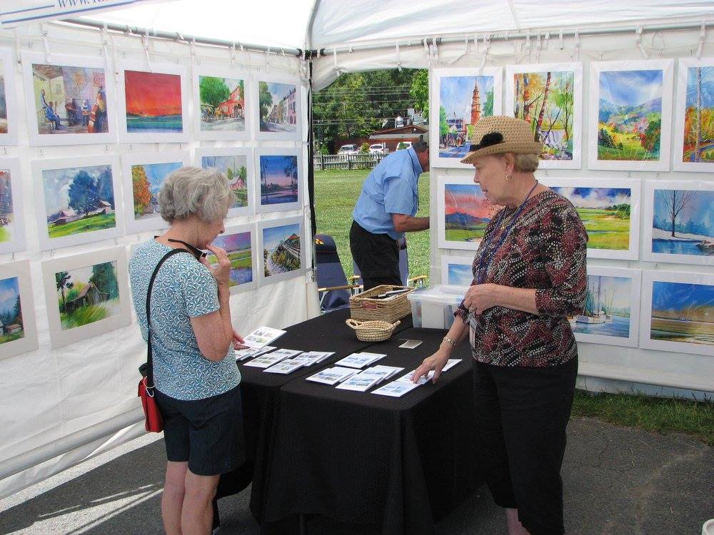 Ladies discussing art at the Art on the Greene Event in Banner Elk, NC